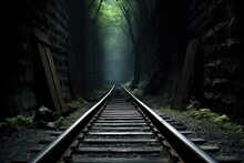 Subway Tracks Leading Into A Dark Tunnel
