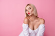 © deagreez - Photo of lovely pretty girl dressed white trendy clothes sending you kiss empty space isolated on pink color background