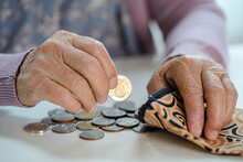 Asian Senior Woman Holding Counting Coin Money In Purse. Poverty, Saving Problem In Retirement.