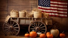 A Rustic Image Of A Wagon Filled With Pumpkins And Hay Bales With An American Flag Draped Over Them