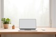 Copy space mockup template laptop monitor with a white screen on a wooden table. Cozy minimalistic workplace at home near window, Generative AI.