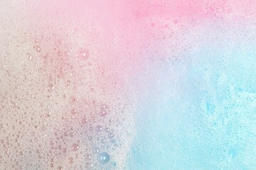  Colorful foam after dissolving bath bomb in water, closeup