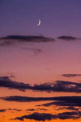 Wall Mural - color sunset sky with clouds and bright shining moon