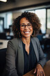 © Made360 - Portrait of a confident African American businesswoman with a cheerful smile in a modern office setting as an illustration of success and leadership in the corporate industry
