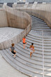 © Drobot Dean - Top view group of people running up stairs together during outdoor workout