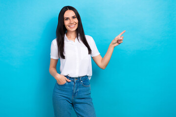 Sticker - Photo of sweet charming lady wear white shirt pointing finger empty space isolated blue color background