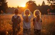 © tongpatong - Friendship group of children raising their hands in a queue at dusk on the verdant park grass. .