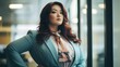 Plus size beautiful business woman model in a suit, in office