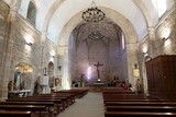 Fototapeta Na drzwi - Church of the Assumption, Cadalso de los Vidrios, Madrid, Spain, November 18, 2023: General view of the Parish Church of the Assumption (16th century). Cadalso de los Vidrios, Madrid, Spain