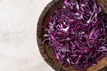 red cabbage, sliced, in a wooden salad bowl, top view, no people,