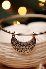 Canvas Print - A bangle bracelet with a gold pendant on it, AI