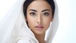 © mashimara - Elegant portrait of an Asian woman with flawless skin and an exquisite hairdo, grace and beauty against a soft white background.