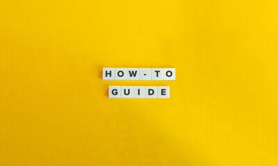 Wall Mural - how-to, guide, guidance, advice, direction concept image. letter tiles on yellow background. minimal