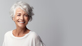 Fototapeta  - beautiful elderly woman model with beautiful gray hair smiling in the studio isolated on white background. copy space