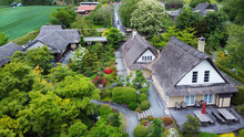Idyllic Drone Point Of View On Japanese Garden In Odense District With Houses With Thatched Roofs