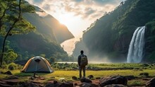 A Man Traveller Walk Togather Tent And Camping With Mae Tia Waterfall And Mountain Background At Inthanon National Park In Chiang Mai, Thailand, Un Seen Travel Point For Camping And Relax In Holiday