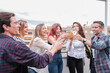 © Ivan - Group of friends toasting together on the terrace and celebrating and laughing. Concept: lifestyle, toast