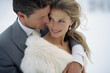 © lagano - Young couple, bride and groom in the snow. Concept of winter weddings, love and marriage.
