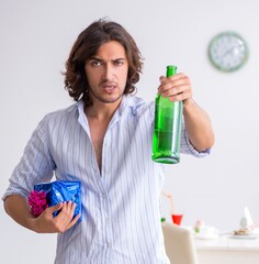 Wall Mural - Young man celebrating his birthday at home