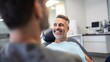 smiling adult man sitting in dentist chair.