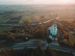 Canvas Print - Aerial autumn view at church in Chelmno on the Ner River, a village in Poland