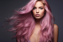 Woman With Wavy Pink Hair On A Gray Background. Beauty And Fashion
