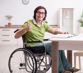 Wall Mural - Young male student in wheelchair at home