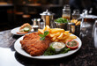 Authentic Austrian Viennese Veal Schnitzel with French Fries in Restaurant Setting