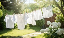 A Colorful Array Of Clothing Hanging On A Breezy Clothesline