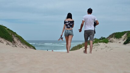 Poster - Rear view of couple heading towards beach