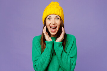 Sticker - Young fun woman she wear green sweater yellow hat casual clothes scream sharing hot news about sales discount with hands near mouth isolated on plain pastel light purple background. Lifestyle concept.