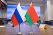 Flags of cooperation between Russia and Belarus. Flags of Russia and Belarus on the negotiating table. Ideal for news.