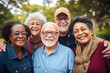 © MVProductions - Group of happy diverse seniors in an urban park environment, embracing outdoors, showcasing diversity and friendship.