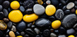 Black and yellow stones as a backdrop, spa and feel-good atmosphere, round washed pebbles, 