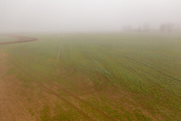  Drone photography of meadow and farmland in autumn morning fog