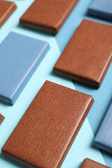 Wall Mural - Blue and brown chocolate bars on a blue background