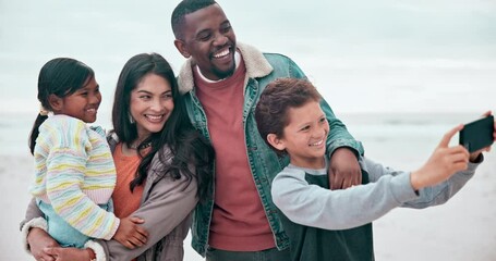 Wall Mural - Family, selfie and happy on beach with love, hug and bonding on vacation, travel or adventure by ocean. Interracial, parents and kids with phone at sea for experience, relationship or care and smile