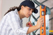 © auremar - closeup of a young woman using spirit level