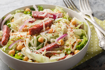 Wall Mural - La Scala Chopped Salad with simple ingredients like chopped romaine, salami, and mozzarella close-up in a bowl. Horizontal