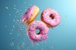 Flying Frosted sprinkled donuts. Set of multicolored doughnuts with sprinkles isolate on color background. 3d rendering