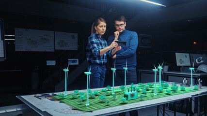 Wall Mural - renewable energy engineers design 3d wind turbine park using augmented reality software and smartpho
