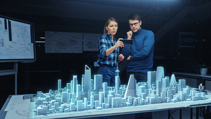 Wall Mural - architect and engineer have discussion, use augmented reality smartphone to design sustainable 3d me