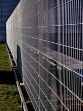 Strong Galvanized Welded Mesh Fencing Is Used Around Industrial Halls And Logistics Centers And Airports. Gate With Handle And Lock. Durable And Cheap Parts Can Be Quickly Built Anywhere