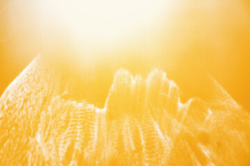 Wall Mural - white shiny glare from sunlight on yellow background, abstract nature photo with sunshine flare, viv