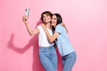 Poster - Photo of relatives two best friends girls hugs together chill selfie cadre portrait have fun shopping isolated on pink color background