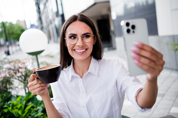 Sticker - Portrait of lovely positive girl hold fresh coffee cup smart phone make selfie lunch break street care outdoors