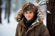 © Tetiana - Generative AI portrait of young cute boy teenager in snowy forest tree magic atmosphere