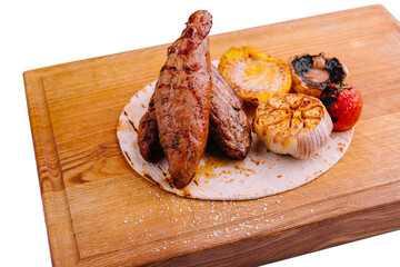 Wall Mural - Grilled Tenderloin steak with vegetables on wood