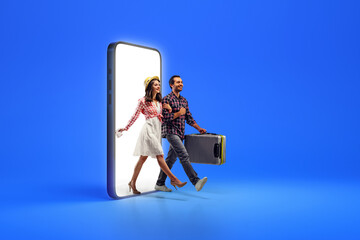 Wall Mural - Creative collage with photo of happy young people, lovely couple with baggage, going out from blank phone to book tickets on honey moon against blue background.