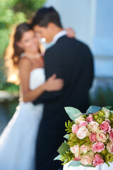 Sticker - Flower bouquet, happy couple and blurred embrace at wedding with love, smile and commitment at reception. Roses, woman and man hugging at marriage celebration event, partnership and future together.